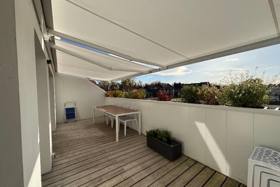 Pose de deux stores de terrasse avec lambrequin à Lille